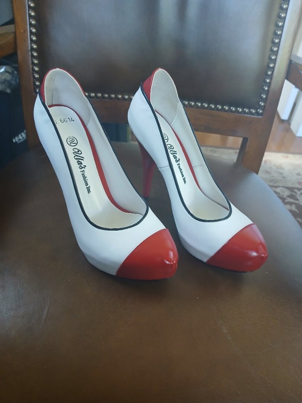 New and unworn red and white leather pumps.